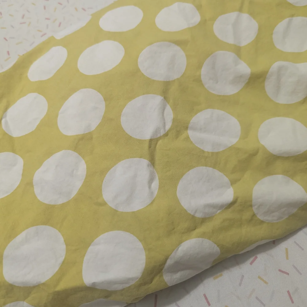 The Land of Nod Not A Peep Quilt And Yellow Polka Dot Fitted Crib Sheet